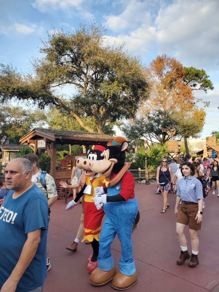 Horace Horsecollar and Clarabelle Cow walking through Frontierland